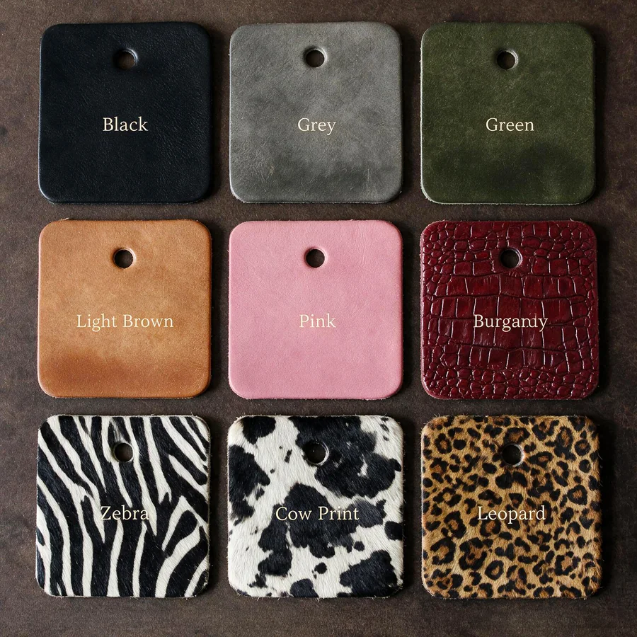 Nine leather swatches: black, grey, green, light brown, pink, burgundy croc, zebra, cow print and leopard